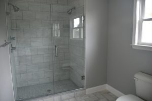 Barrier-free walk-in shower with slip-resistant tile flooring.