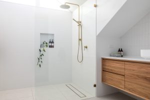 Barrier-free shower in a Niagara Falls home with handheld spray and bench for seated use.
accessibility construction